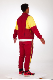 Nabil a-pose dressed high-top sneakers red athletic tracksuit sports standing…